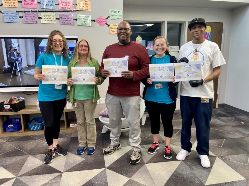 During a March 2 award ceremony, HOB staff (l-r) Cherylyn Minto, Kate Trench, Jerome Foster, Nina Wilkinson and DJ James were presented with certificates of appreciation for helping the robotics teams.